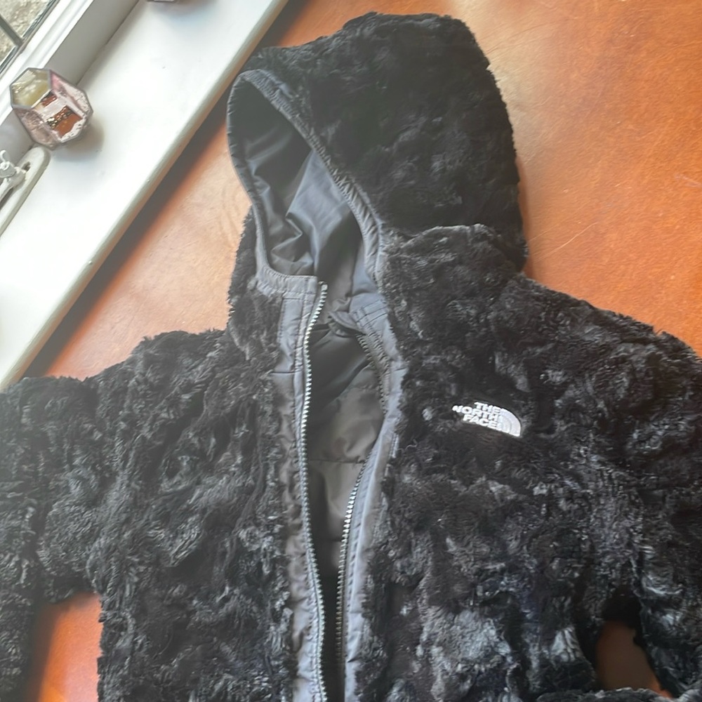 Girls black reversible North Face jacket. Size M (10/12).